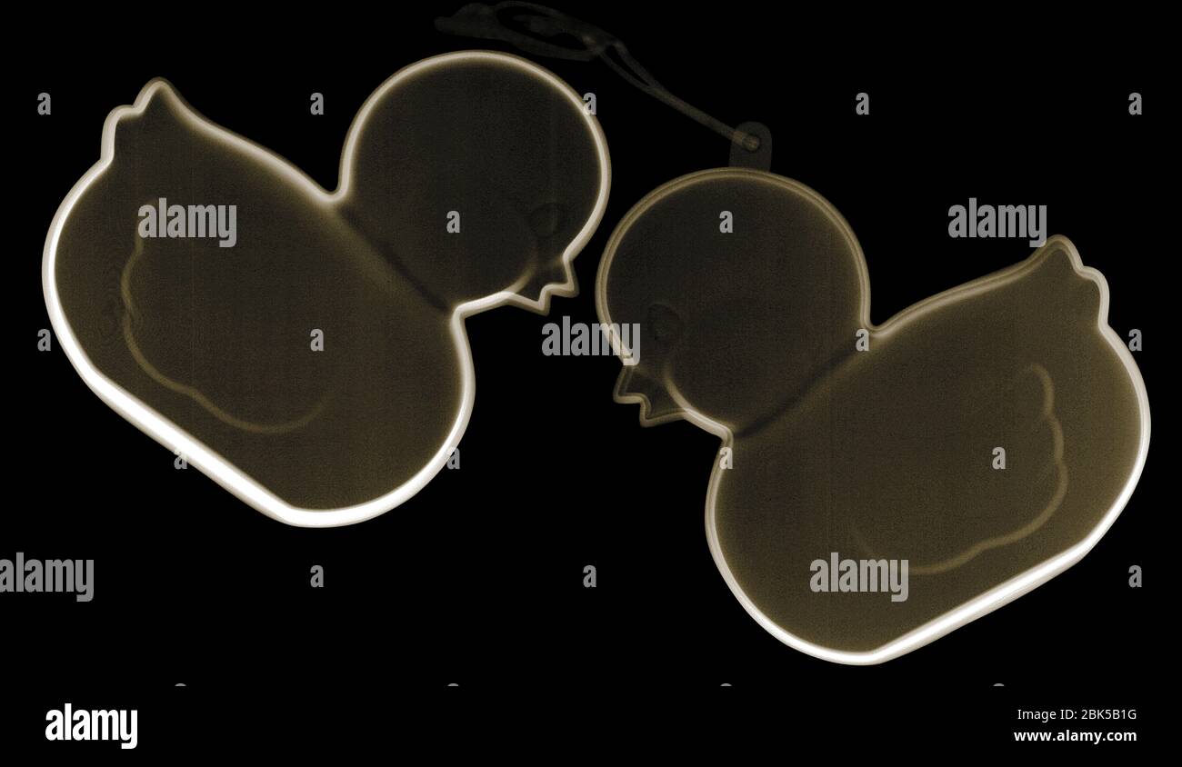 Two rubber ducks, coloured X-ray. Stock Photo