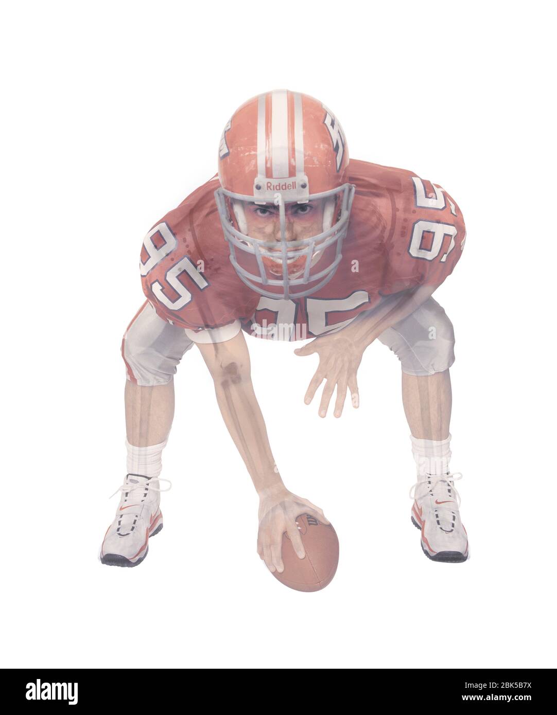 American football player skeleton, coloured X-ray. Stock Photo