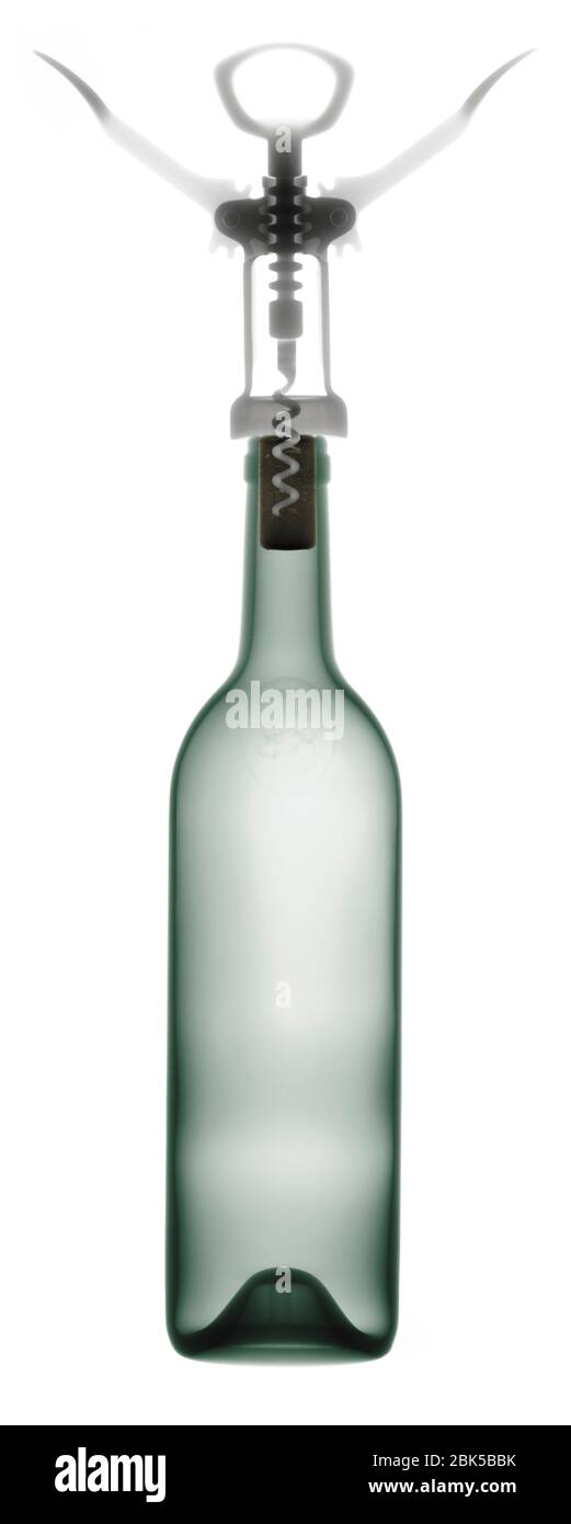 Corkscrew and wine bottle, X-ray. Stock Photo