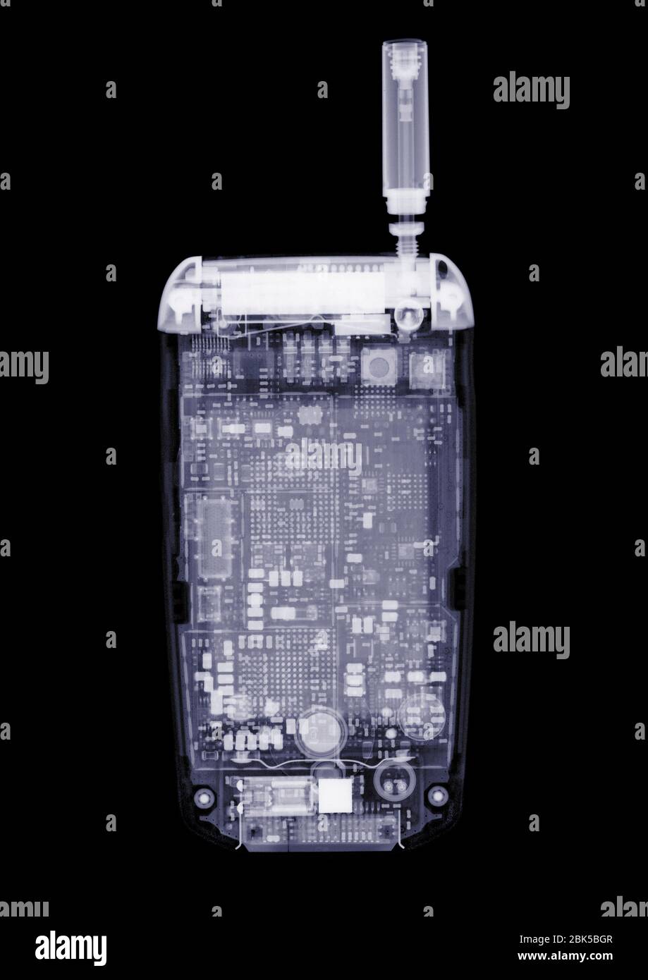 Miniature mobile phone, X-ray. Stock Photo