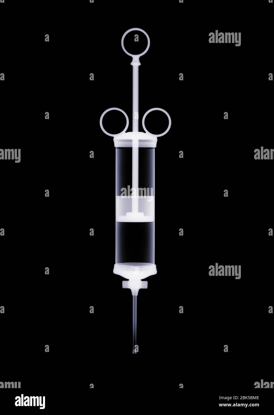 Medical syringe, X-ray. Stock Photo