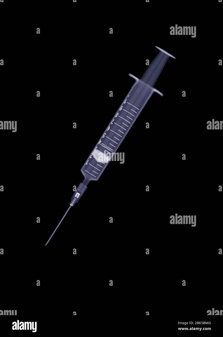 Medical syringe, X-ray. Stock Photo