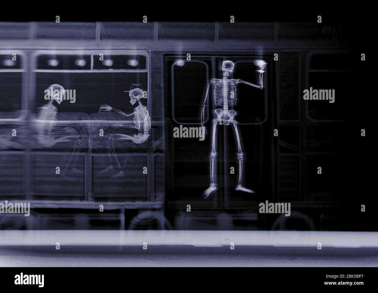 Train with three passengers, X-ray. Stock Photo