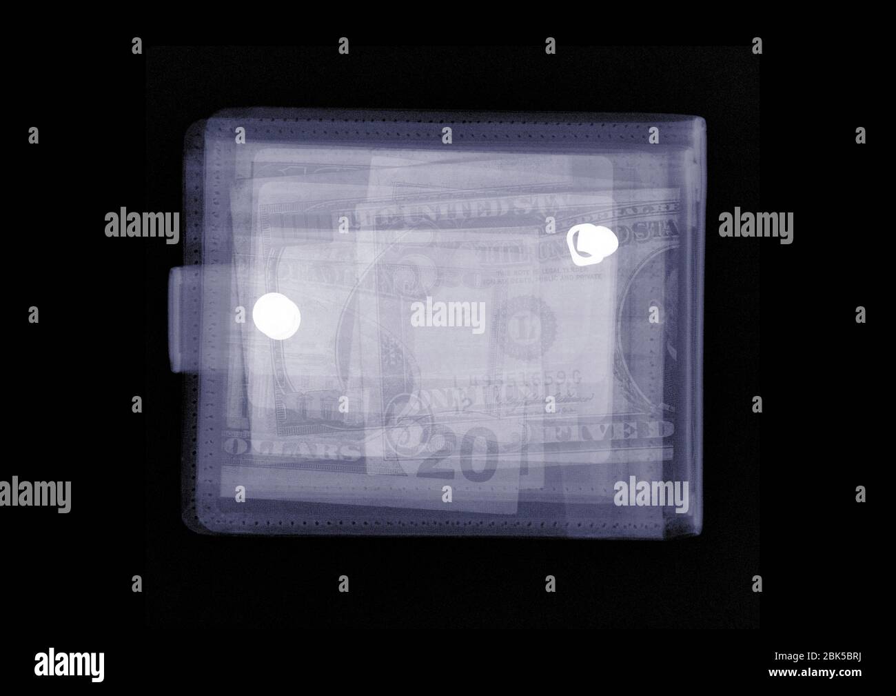 Wallet filled with US currency, X-ray. Stock Photo