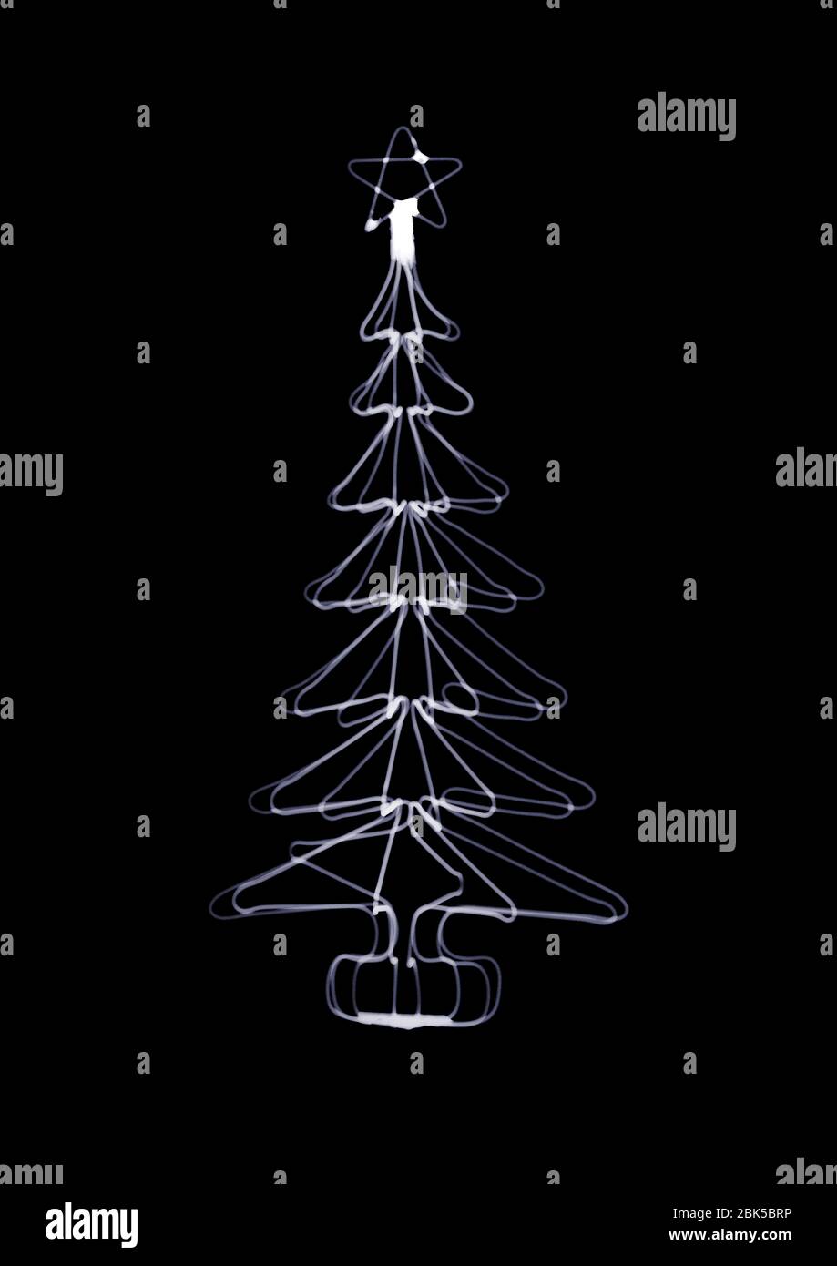 Wire festive tree with a star on top, X-ray. Stock Photo