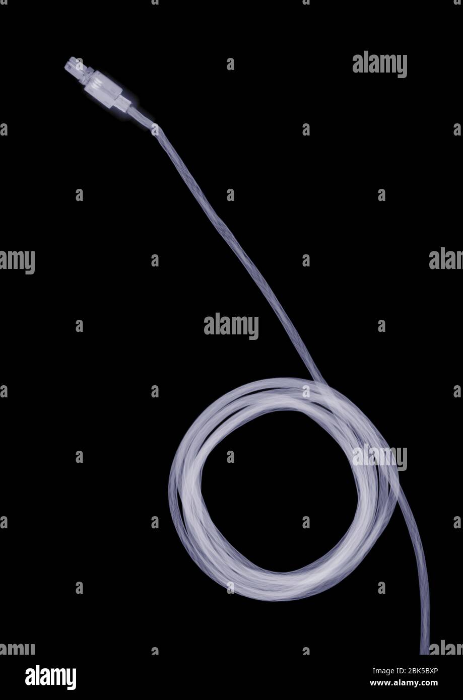Coiled computer cable, X-ray. Stock Photo