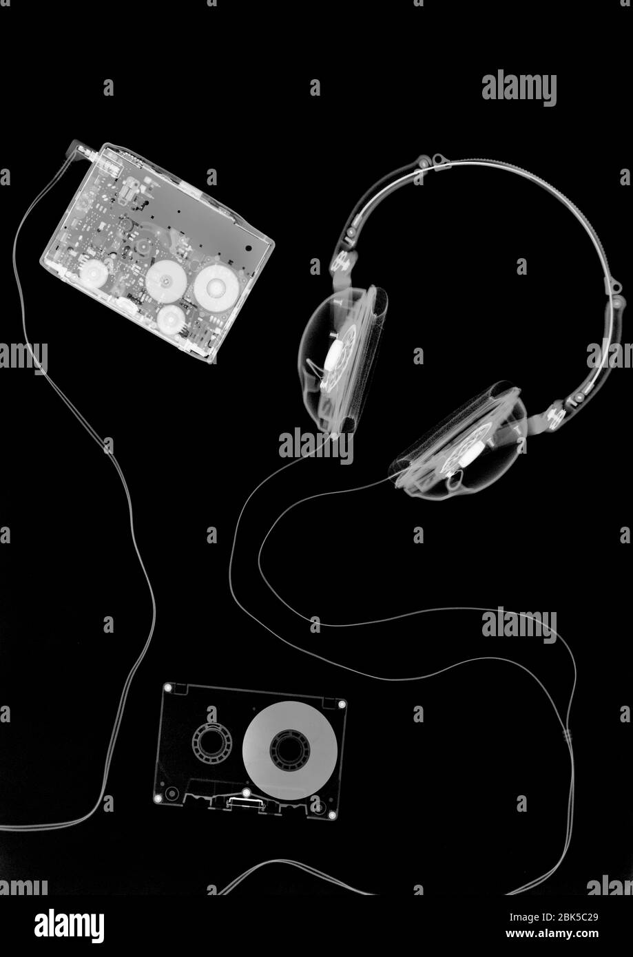 Portable tape cassette player and headphones, X-ray. Stock Photo