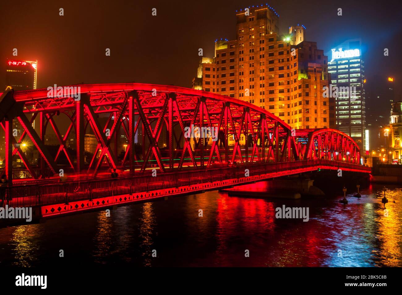 An evening view of Waibaidu Bridge (Garden Bridge) with the Broadway Mansions Hotel behind. Shanghai, China. Stock Photo