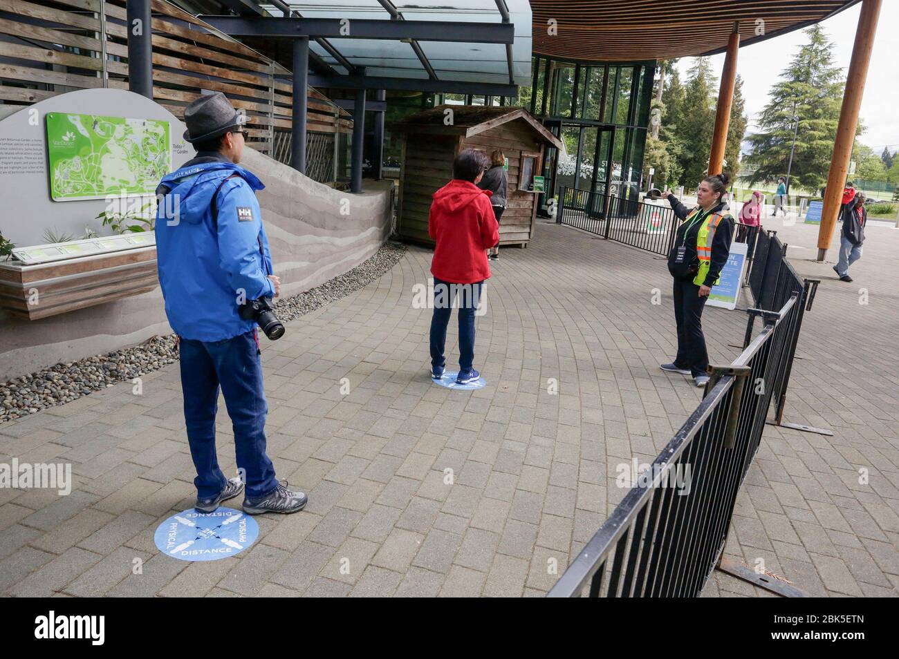 Vancouver, Canada. 1st May, 2020. People line up with social distancing to enter the reopened VanDusen Botanical Garden in Vancouver, Canada, on May 1, 2020. Vancouver started on Friday to gradually reopen public recreation facilities with safety measures amid COVID-9 pandemic. Credit: Liang Sen/Xinhua/Alamy Live News Stock Photo