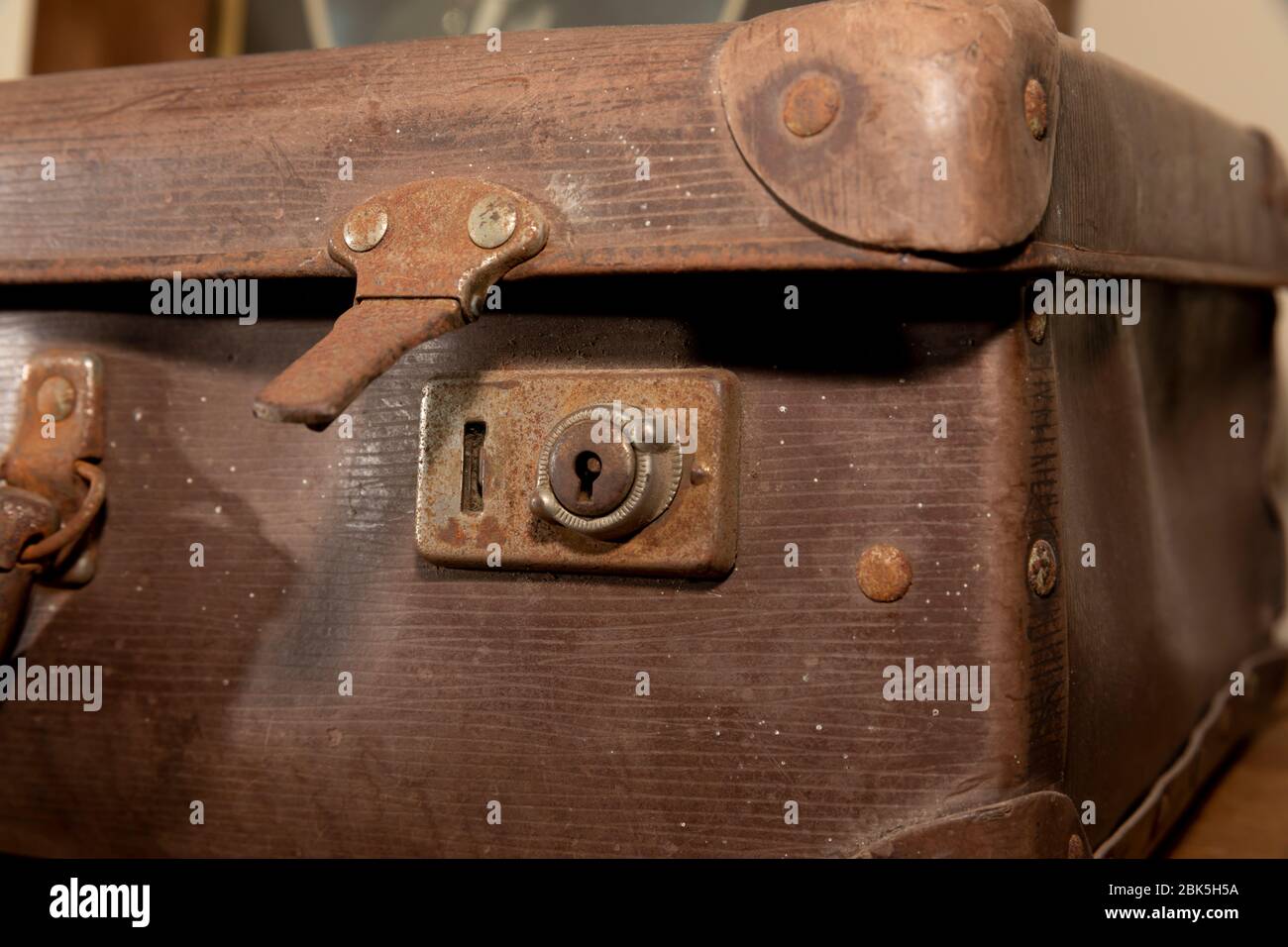 A rusty lock on an old brown leather suitcase Stock Photo