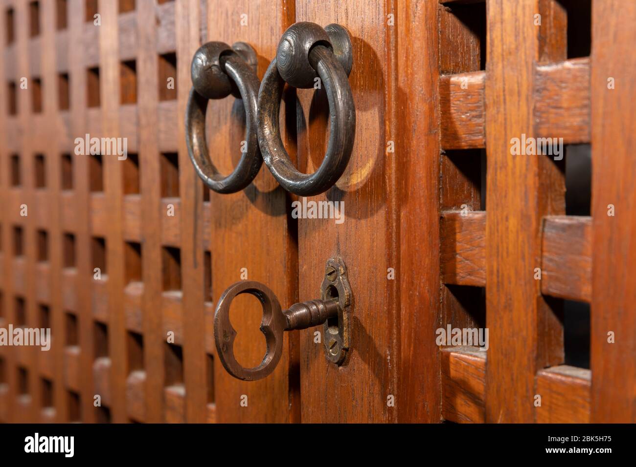 An antique key in an old wooden cupboard Stock Photo Alamy