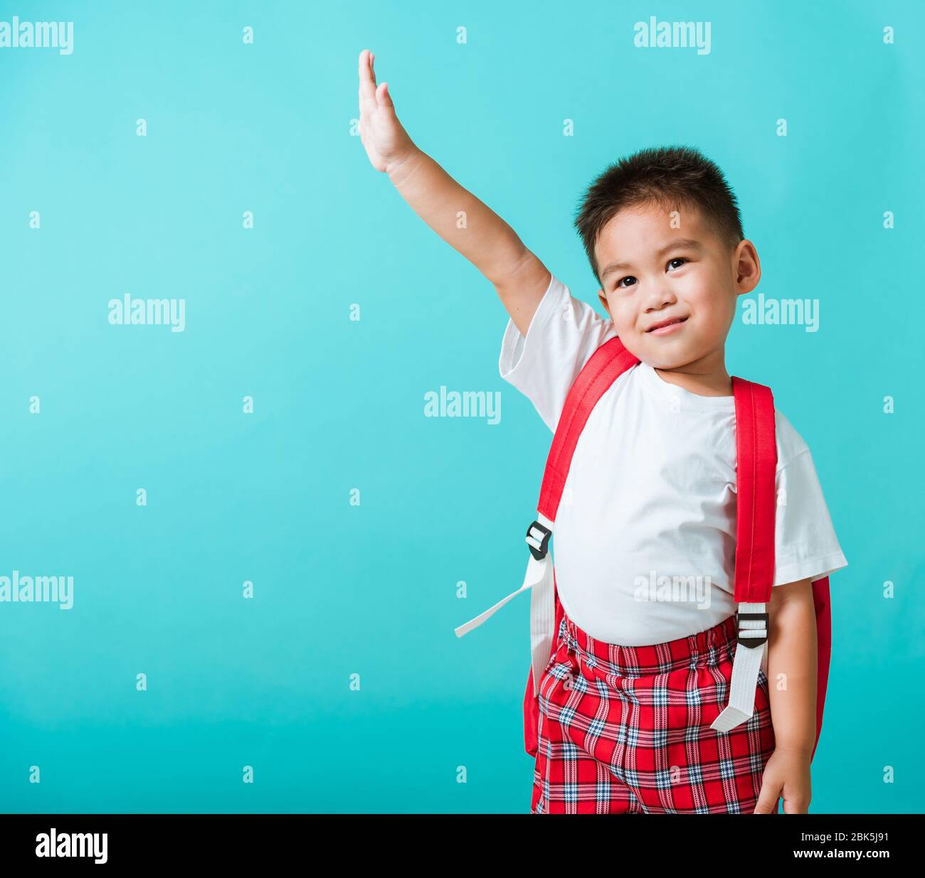 Back To School Portrait Happy Asian Cute Little Child Boy In Uniform Smile Raise Hands Up Glad When Go Back To School Isolated Blue Background Kid Stock Photo Alamy