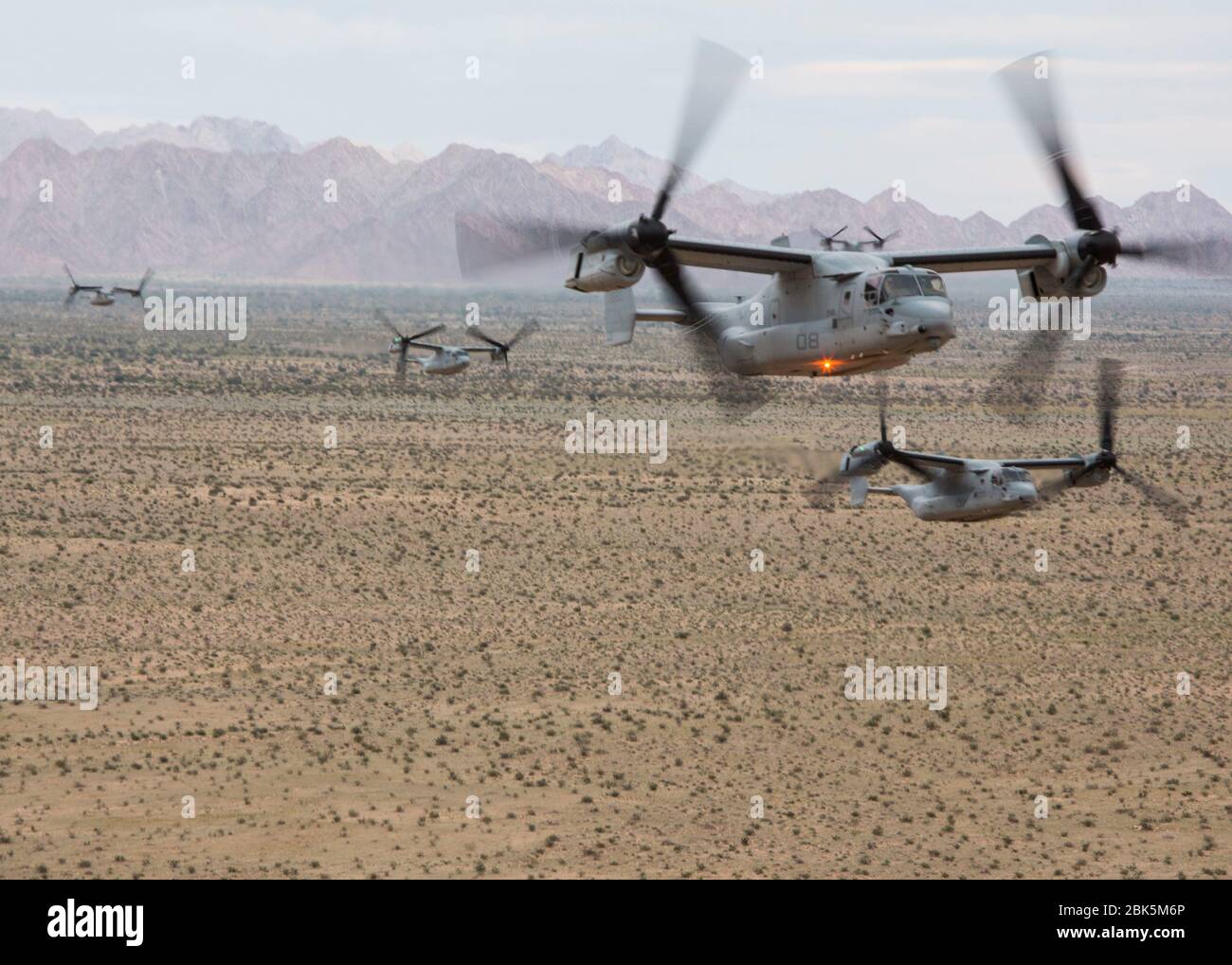 Five U.S. Marine Corps MV-22B Ospreys assigned to Marine Medium Tiltrotor Squadron (VMM) 362, Marine Aircraft Group 16, 3rd Marine Aircraft Wing, conduct a mass flight during a flight leadership evaluation en route to Marine Corps Air Station Miramar, Calif., April 30, 2020. The flight leadership evaluation consisted of six aircraft and tested VMM-362’s ability to rapidly respond with a large airborne contingent in preparation for deployment. (U.S. Marine Corps photo by Lance Cpl. Julian Elliott-Drouin) Stock Photo