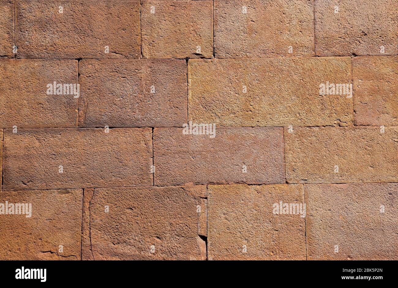 Pinkish-Yellow brick wall texture background Stock Photo