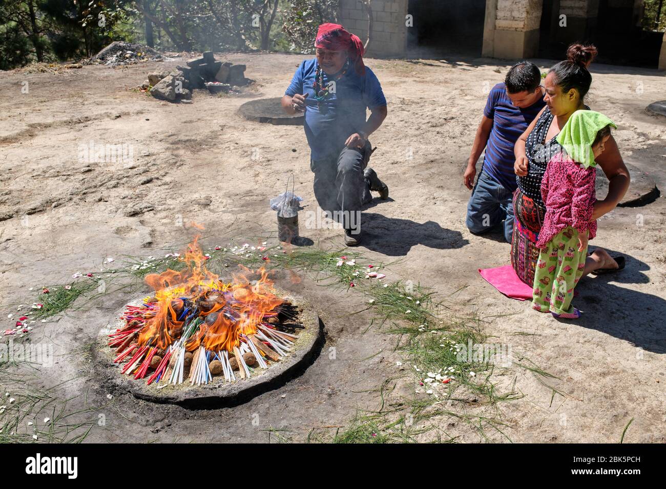 Imayo Ritual Shaman performing a Mayan healing ceremony for a family on the top of ...