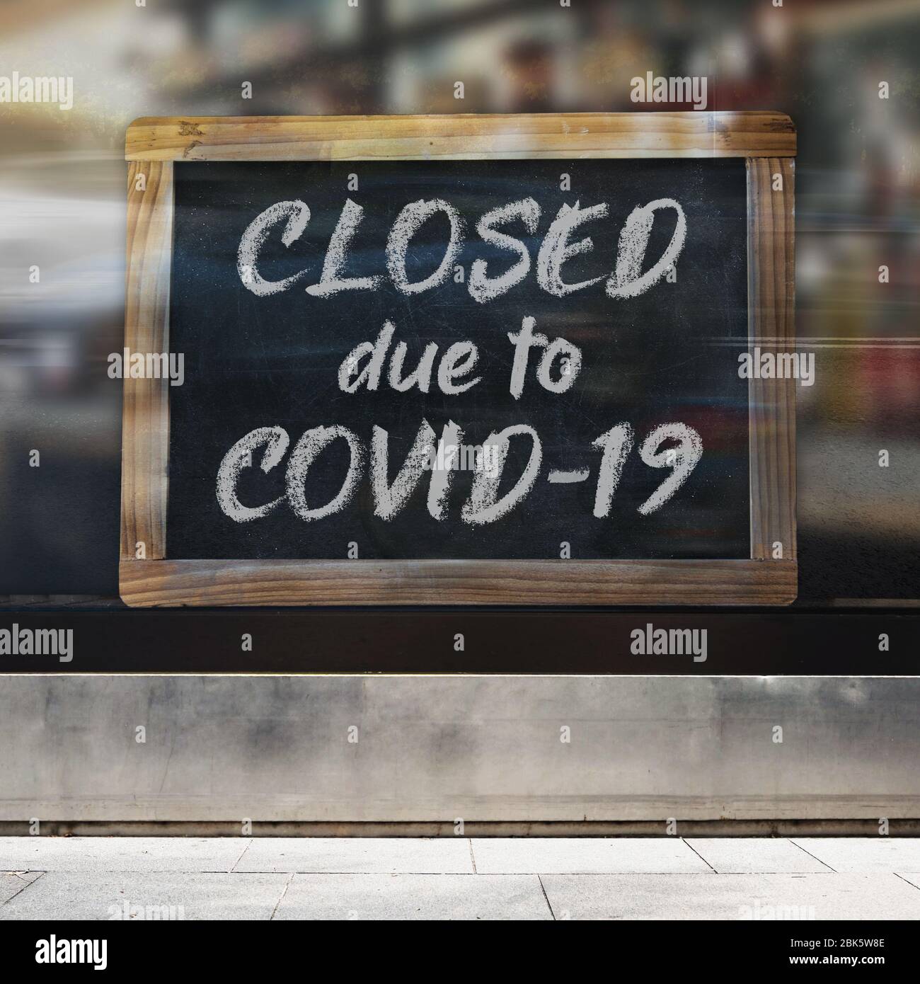 An illustrative image of business sign concept that says ‘Closed due to Covid-19’ on a store / restaurant window. Stock Photo