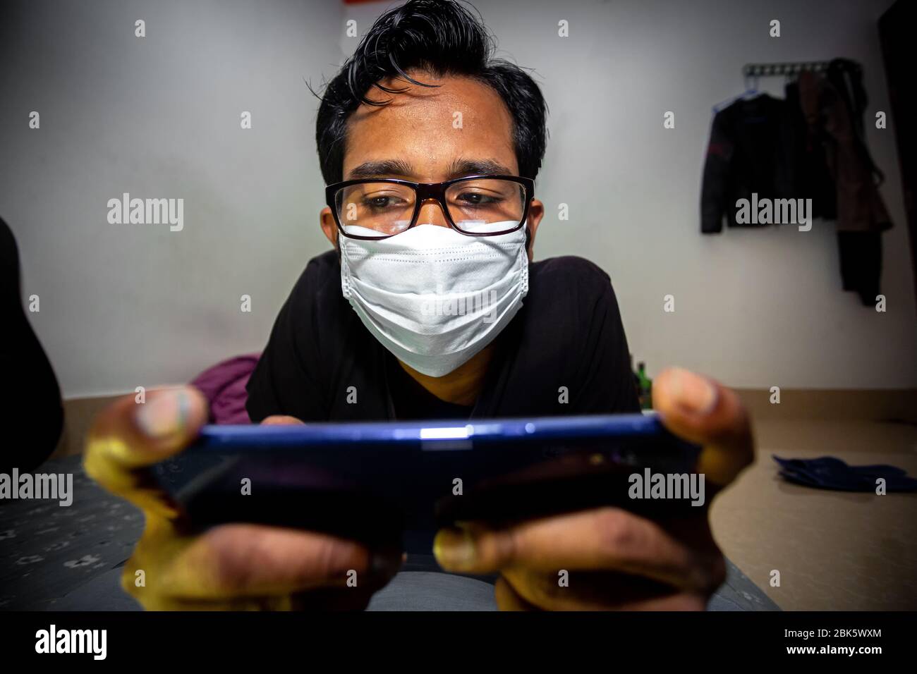 Playing mobile games or video game addiction concept. Addicted gamer