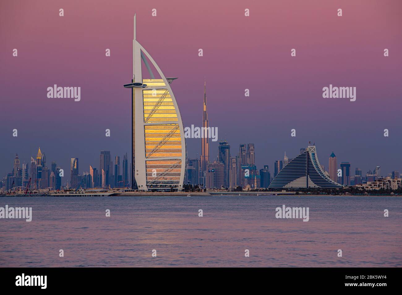 Dubai skyline with Burj Al Arab and Burj Khalifa at twilight, United Arab Emirates Stock Photo