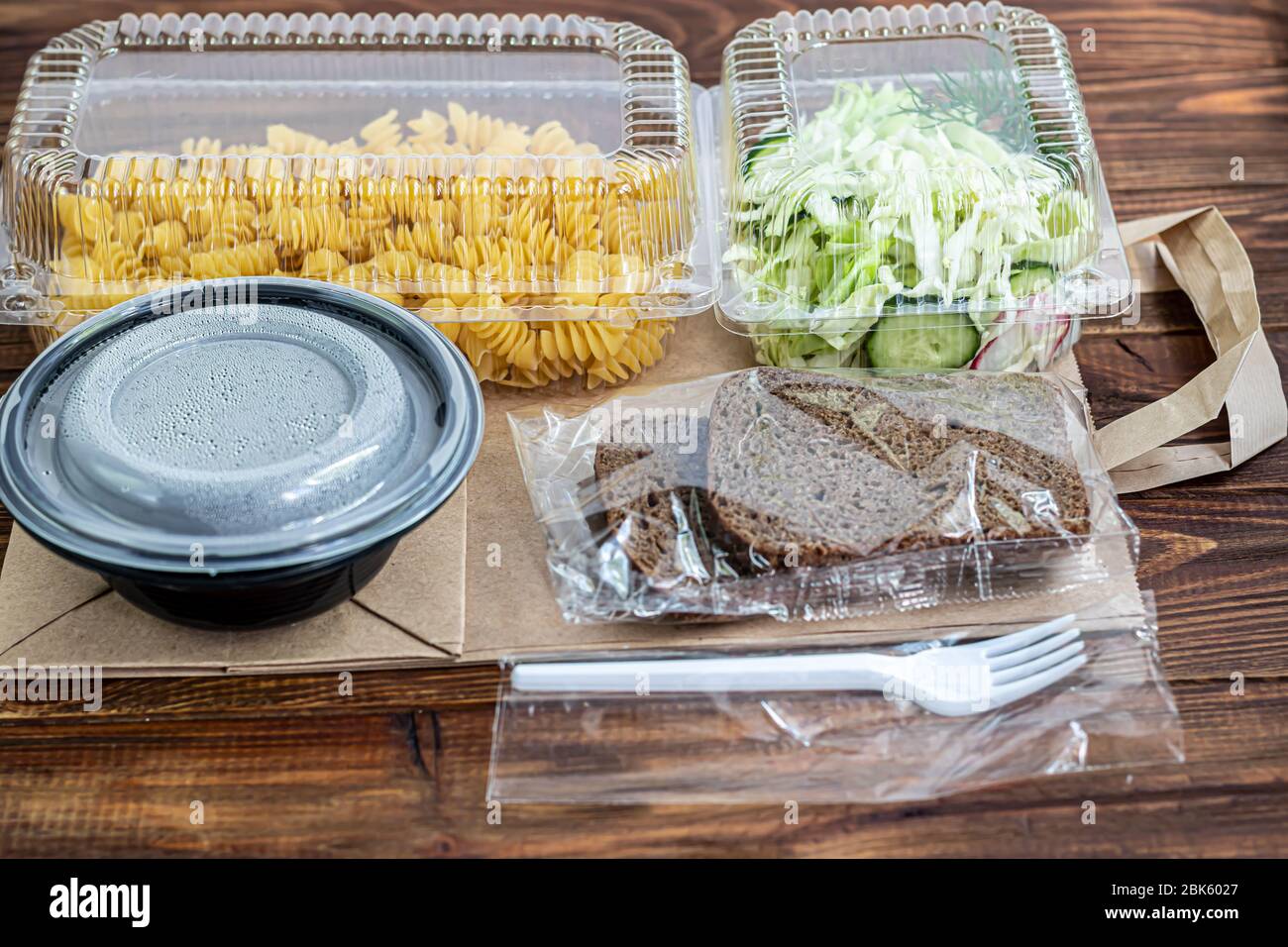 Food delivery during quarantine, for a party. Fast food. The courier