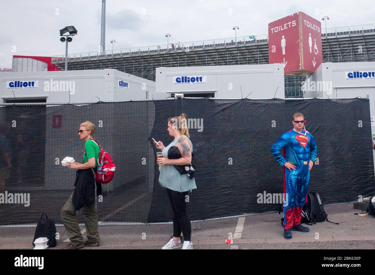 England cricket fan dressed as Superman waits outside the toilet during an England v Pakistan Test Match at Old Trafford cricket ground, Lancashire. Stock Photo