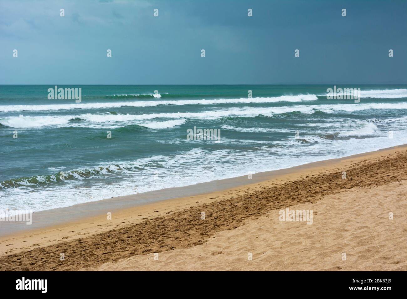 Empty or deserted Kuta Beach in Badung Regency, Bali, Indonesia. Government has been urging people to stay at home to reduce the spread of covid-19. Stock Photo