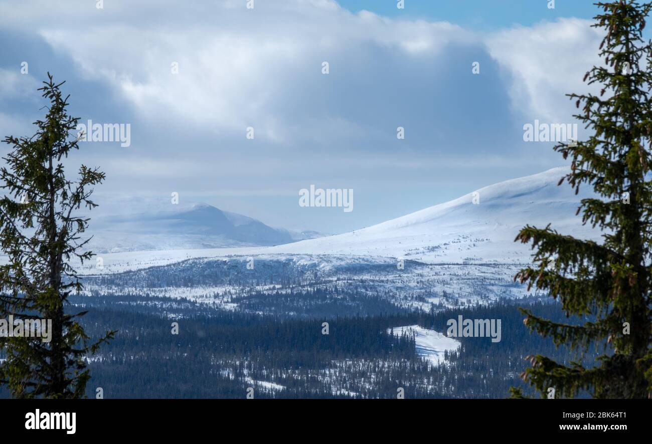 Winter landscape with dramatic snowy mountains. Stock Photo
