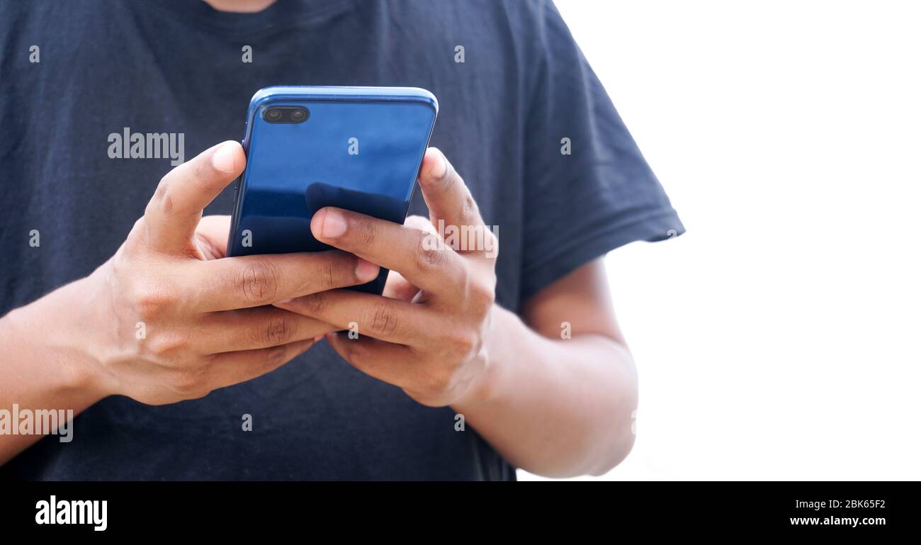 Young Indian man using smartphone Stock Photo
