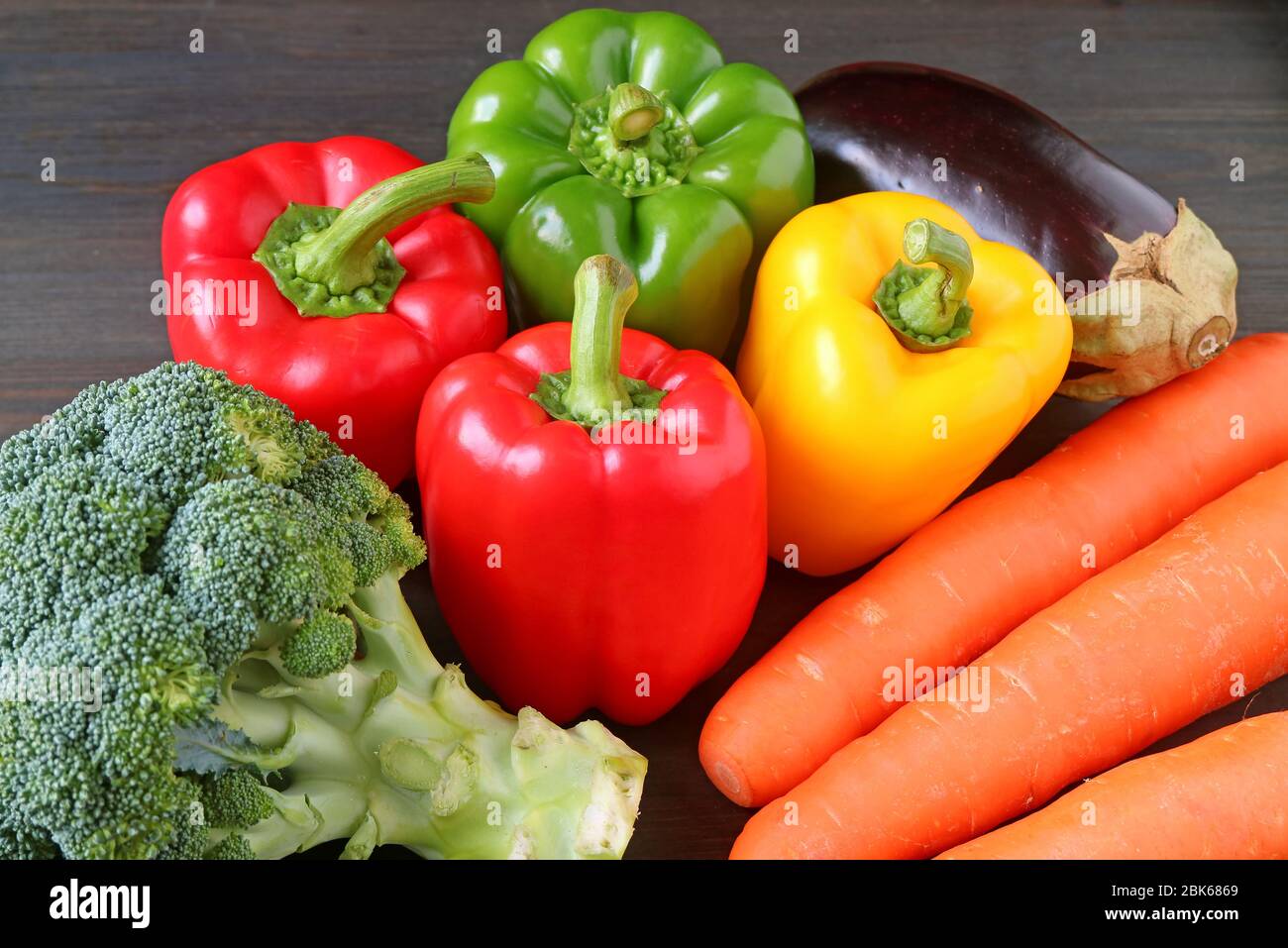 Assorted colorful fresh vegetables on a wooden table Stock Photo