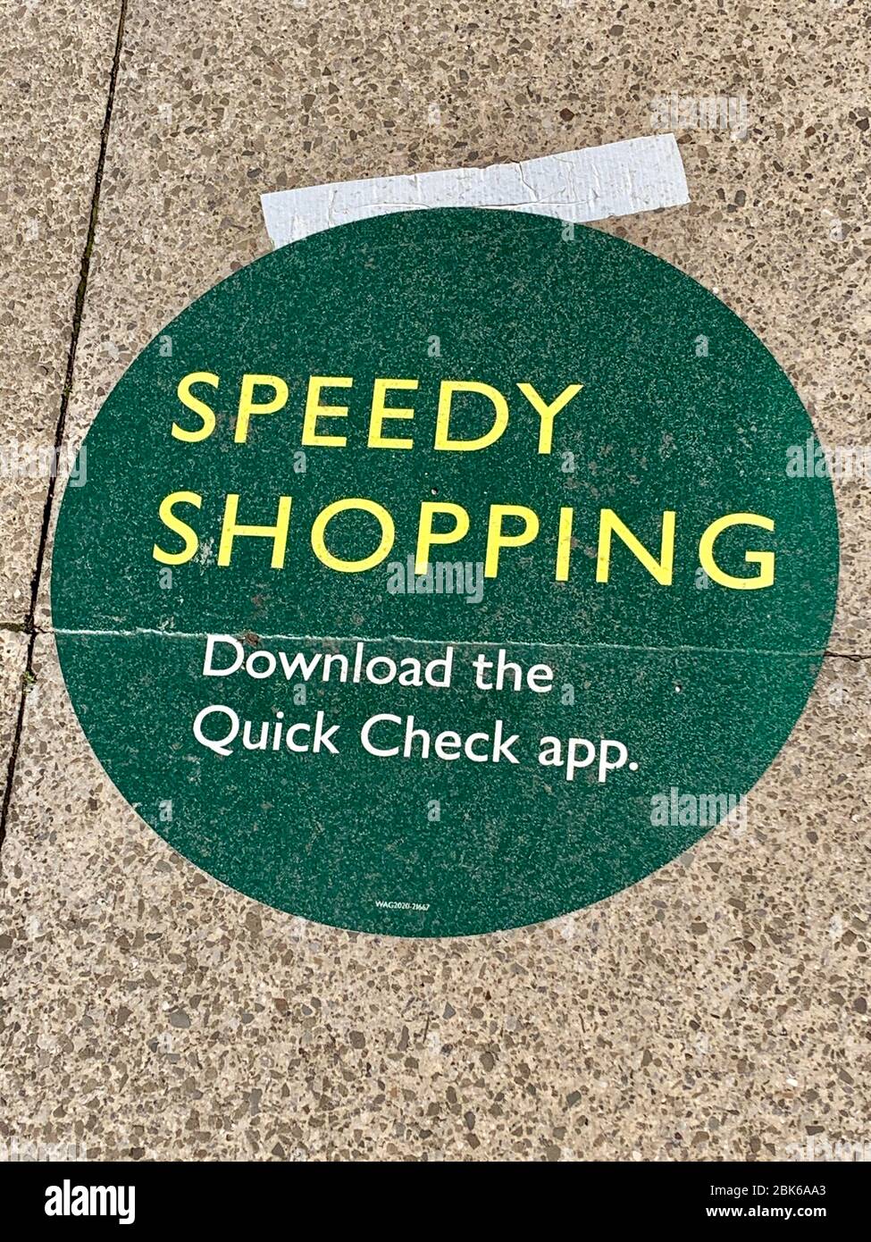 Speedy Shopping - Download the Quick Check App sign on floor outside Waitrose Supermarket in response to covid-19 coronavirus pandemic Stock Photo