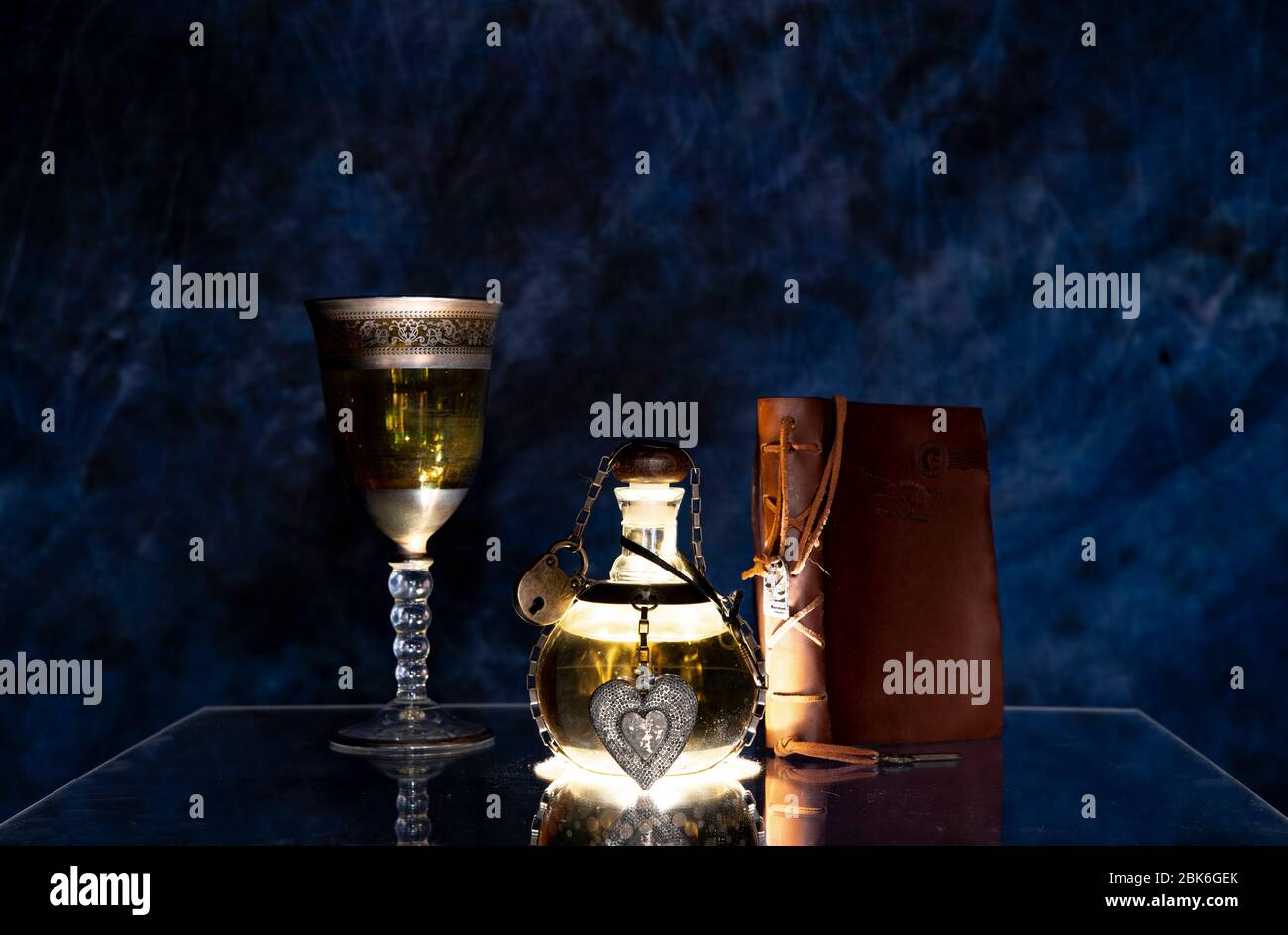 love potion glowing in the dark in the black table Stock Photo
