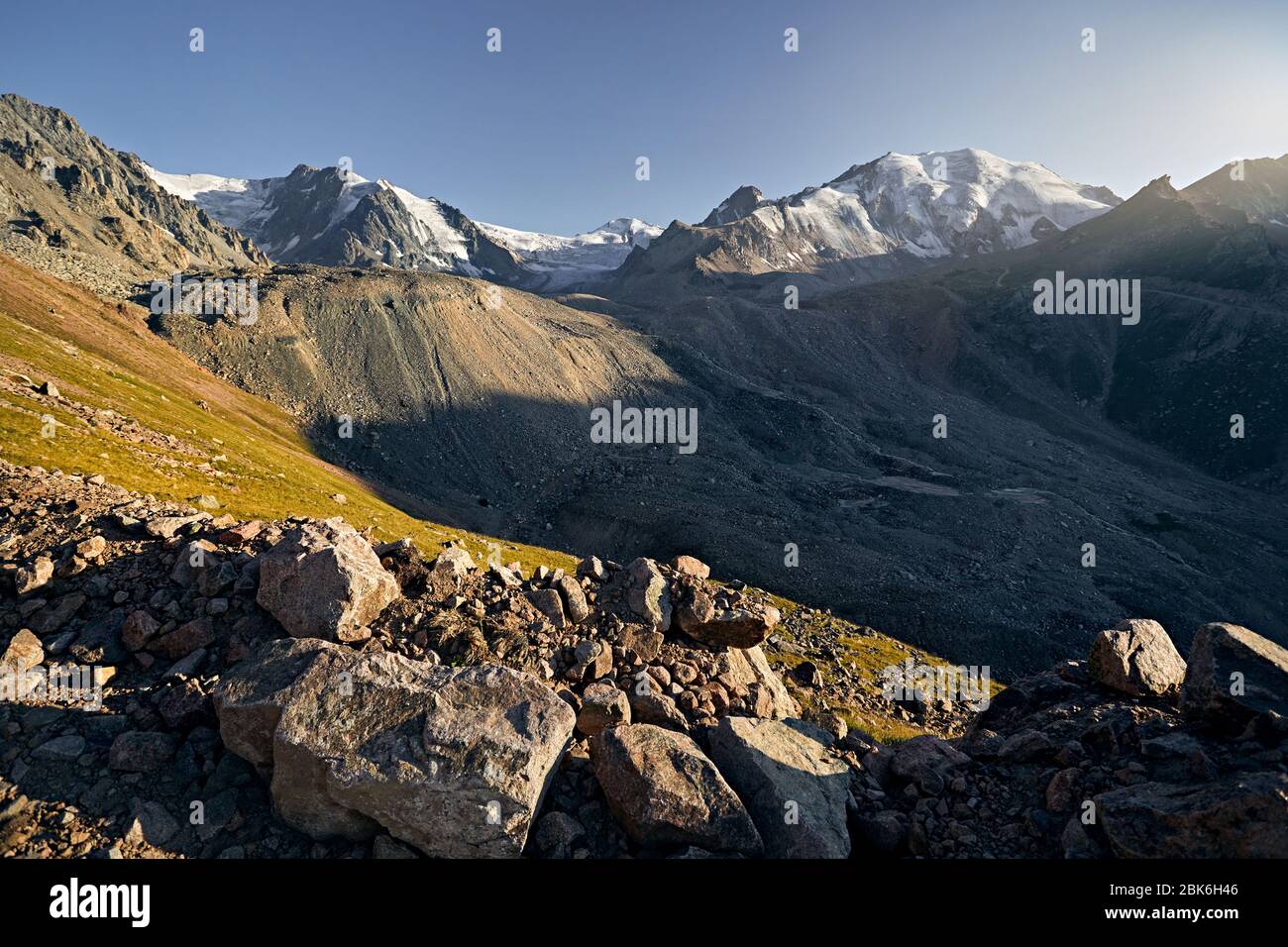 Landscape of snow mountain valley of Tian Shan at sunset in Kazakhstan Stock Photo
