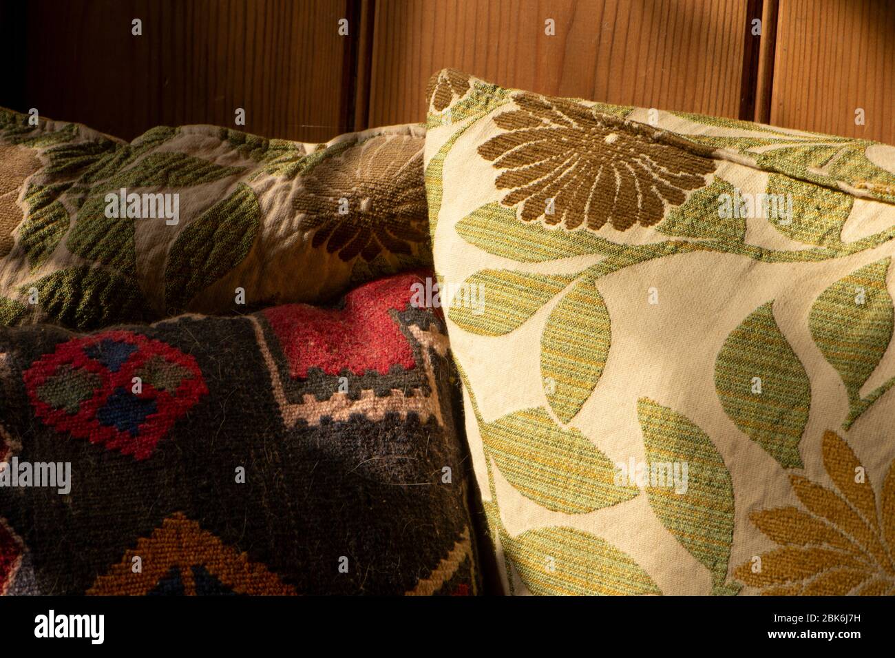 cushions on a pine settle Stock Photo