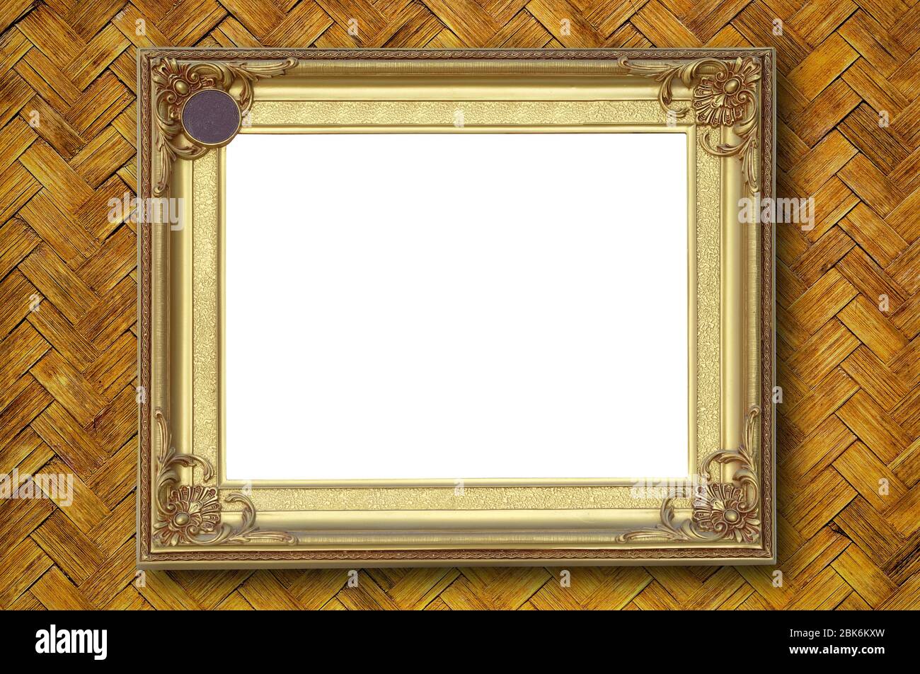 Gold picture frame on weave bamboo wall Stock Photo