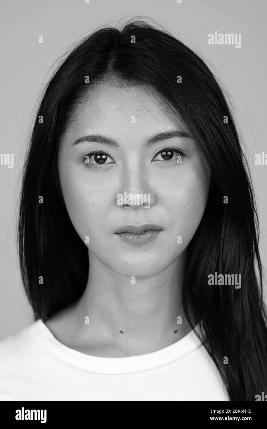 Portrait of young beautiful Asian woman in black and white Stock Photo ...
