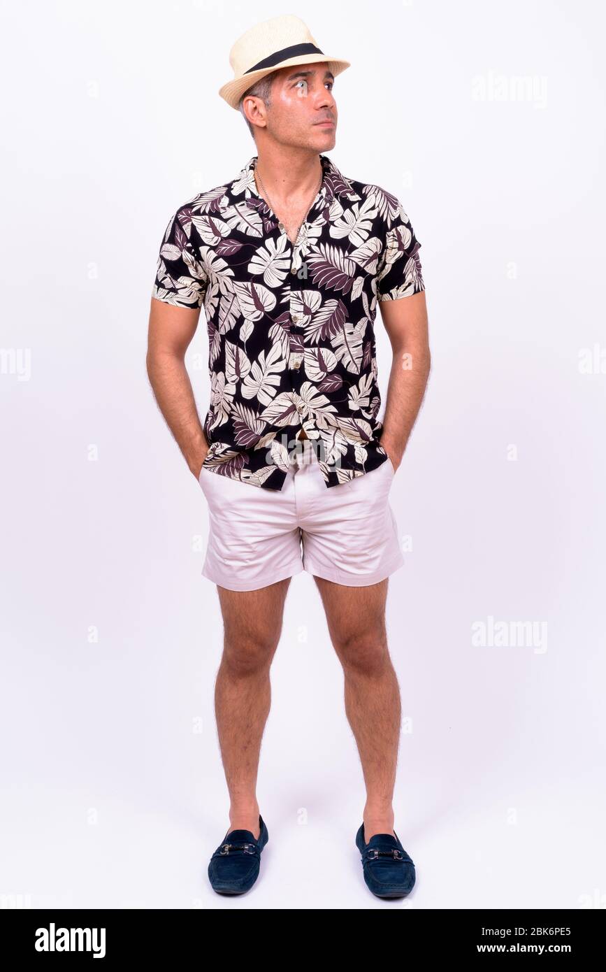 Handsome Persian tourist man against white background Stock Photo