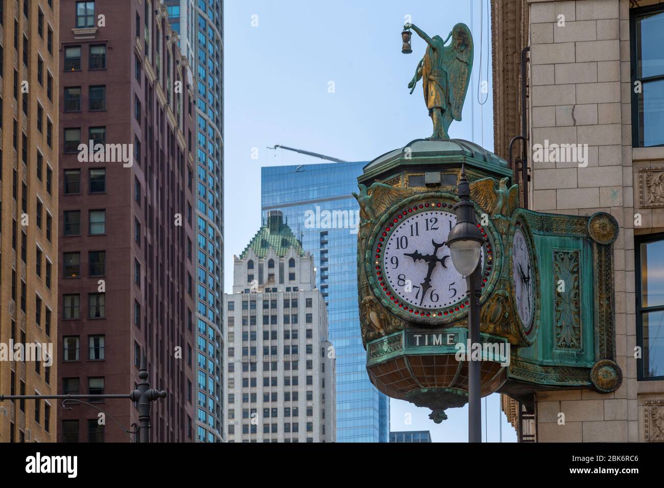 View of ornate clock on street corner, Chicago, Illinois, United States