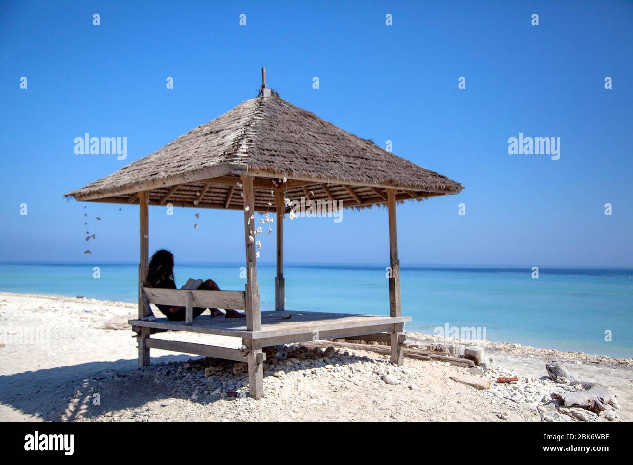 Exotic Beach umbrella and Sunbed, Gili Trawangan island, Indonesia. Stock Photo