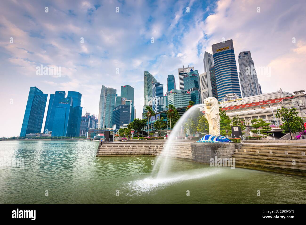 SINGAPORE - SEPTEMBER 3, 2015: The Merlion statue fountain and the Singapore skyline. The landmark statue is considered the personification of Singapo Stock Photo