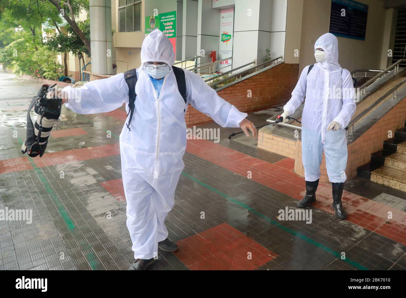 Dhaka, Bangladesh. 2nd May, 2020. Hospital worker disinfect a journalist as he leaves the Mugda Medical College and Hospital after covering an assignment in Dhaka, Bangladesh, May 2, 2020. As many as 540 doctors have contracted Covid-19 in the country so far, accounting for a little over 6.5% of the total infections reported in the country till Friday when the number of cases climbed to 8,238. Credit: Suvra Kanti Das/ZUMA Wire/Alamy Live News Stock Photo