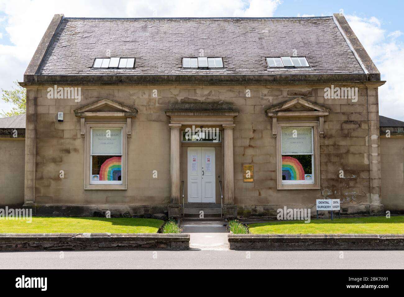 rainbows in the window of a dental surgery in Stirling, Scotland, UK during the coronavirus pandemic Stock Photo