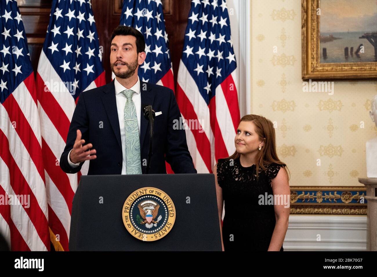 Libby Bish Listens As Rafael Melo Co Founders Of Frontline Fuel Speaks During A Ceremony At The White House In Washington Dc Honoring Volunteers Helping Others Deal With Coronavirus On Friday May 1