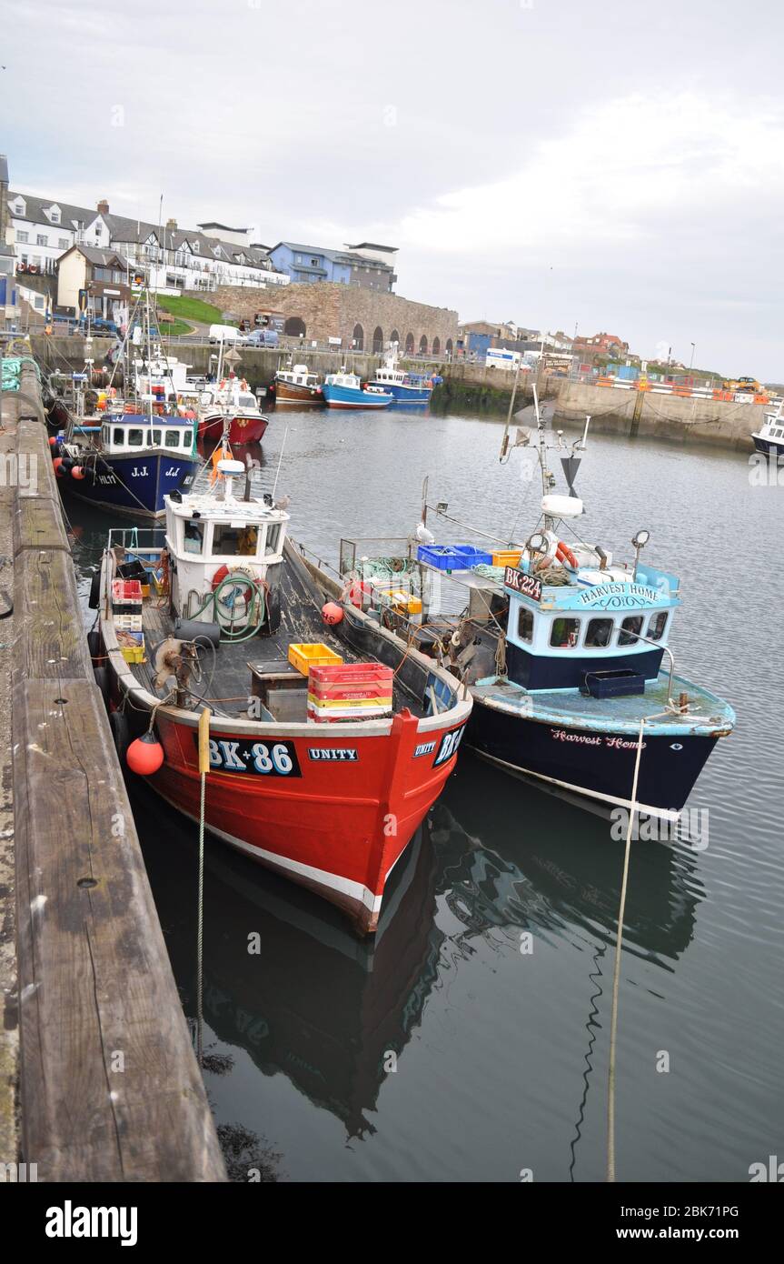 Boats in Seahouses Harbour, Northumberland coast in England Stock Photo ...