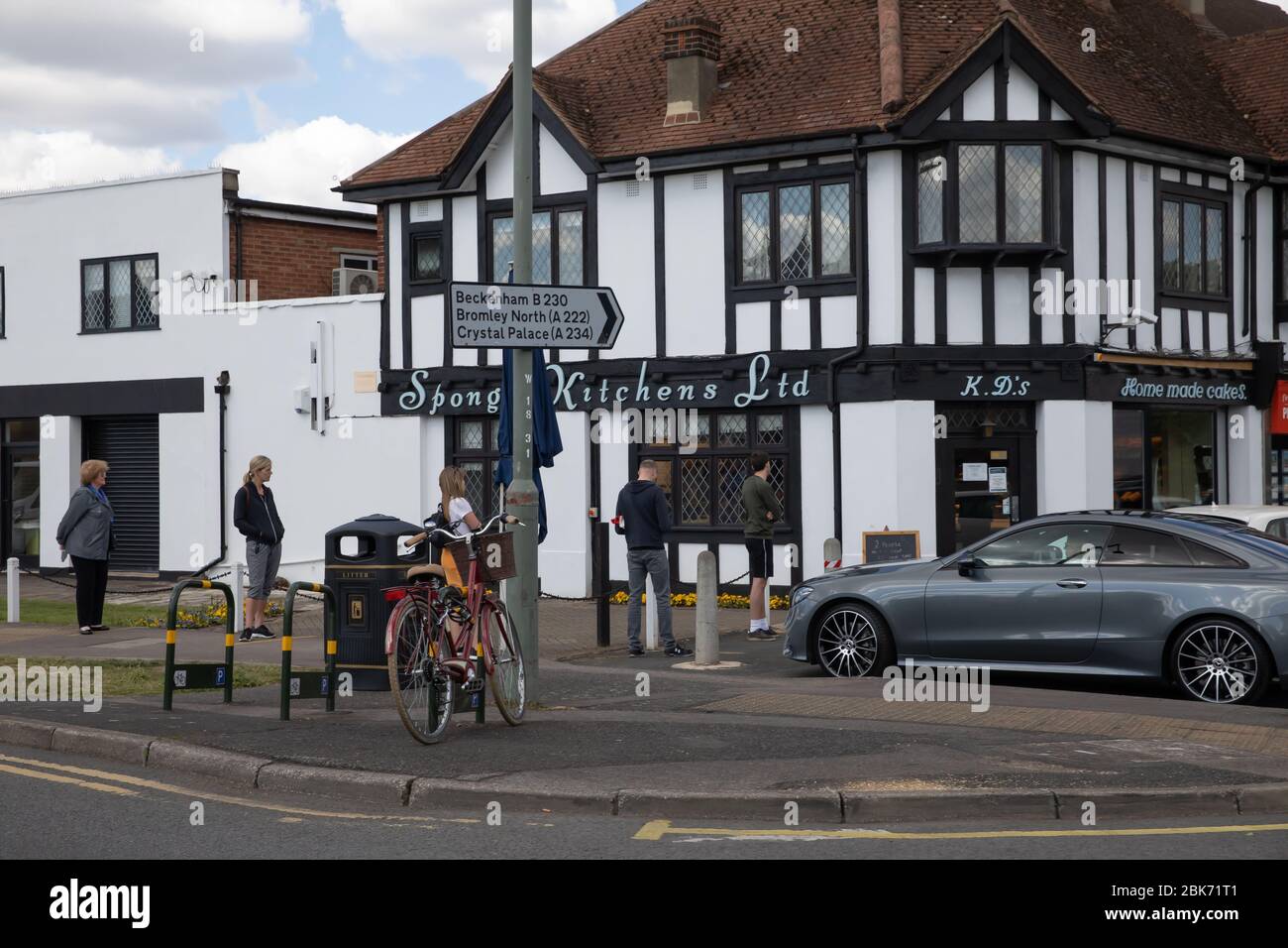 Beckenham,Kent,UK,2nd May 2020,During lockdown people still maintain social distancing of 2 Metres as streets and parks seem strangely quiet. Sponge Kitchens Bakery is open to customers.Credit:Keith Larby/Alamy Live News Stock Photo
