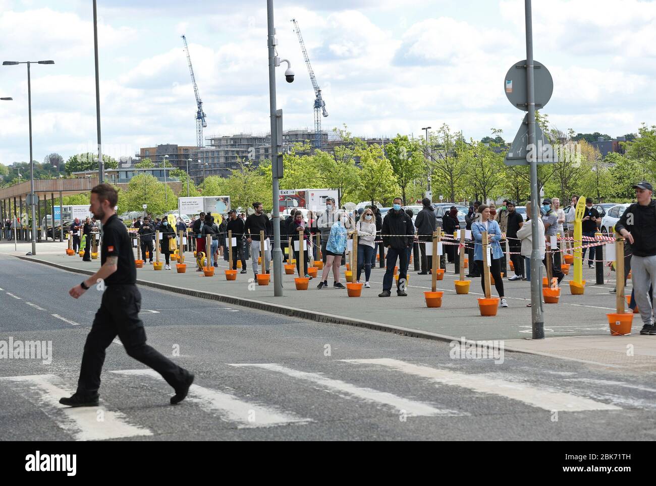 People queuing outside the B&Q Greenwich store, London Stock Photo Alamy
