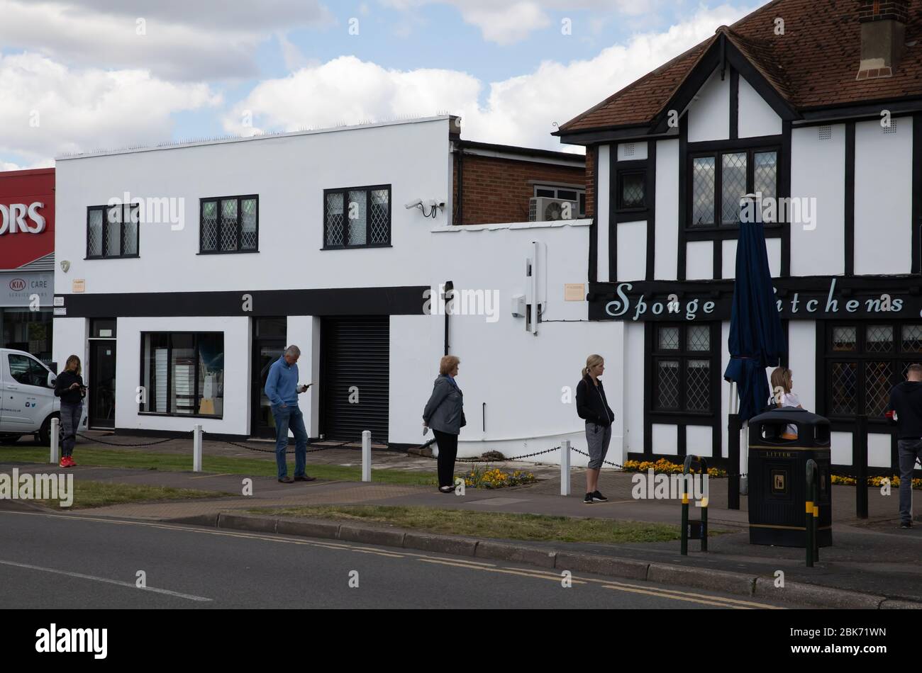 Beckenham,Kent,UK,2nd May 2020,During lockdown people still maintain social distancing of 2 Metres as streets and parks seem strangely quiet. Sponge Kitchens Bakery is open to customers.Credit:Keith Larby/Alamy Live News Stock Photo