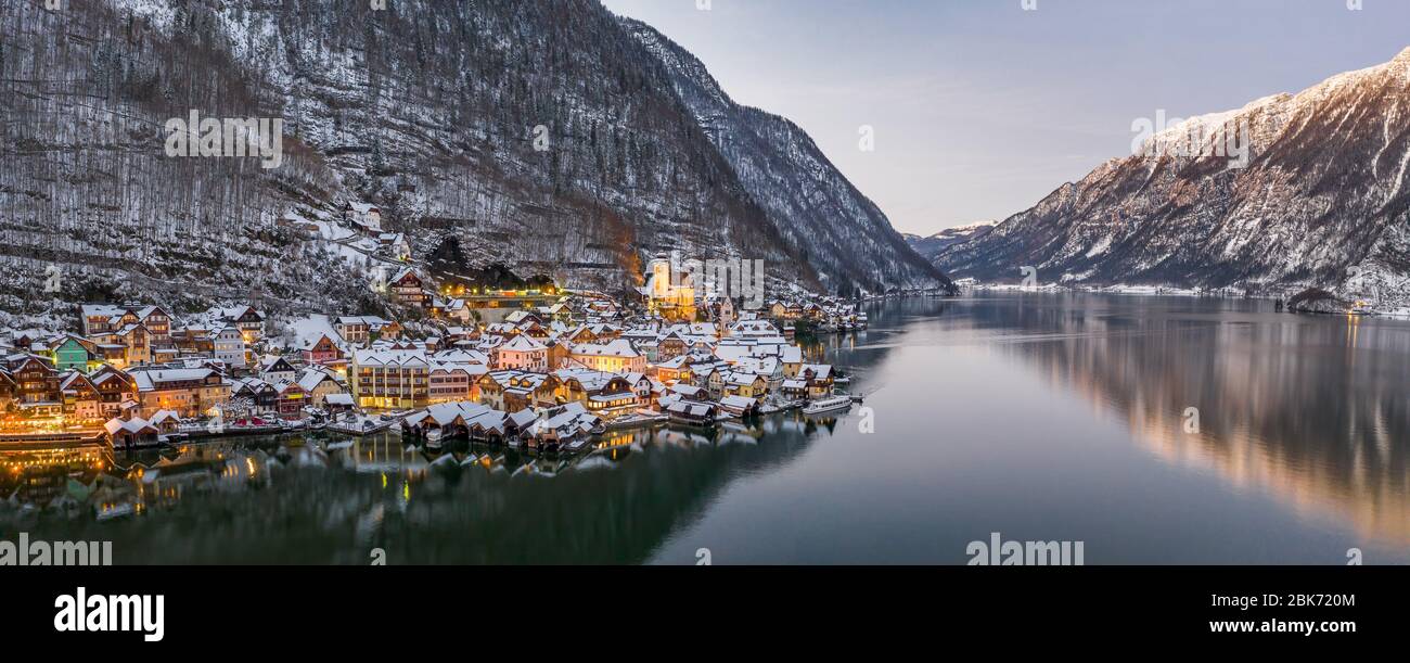 Panoramic aerial drone view of Hallstatt village with lights on Stock Photo