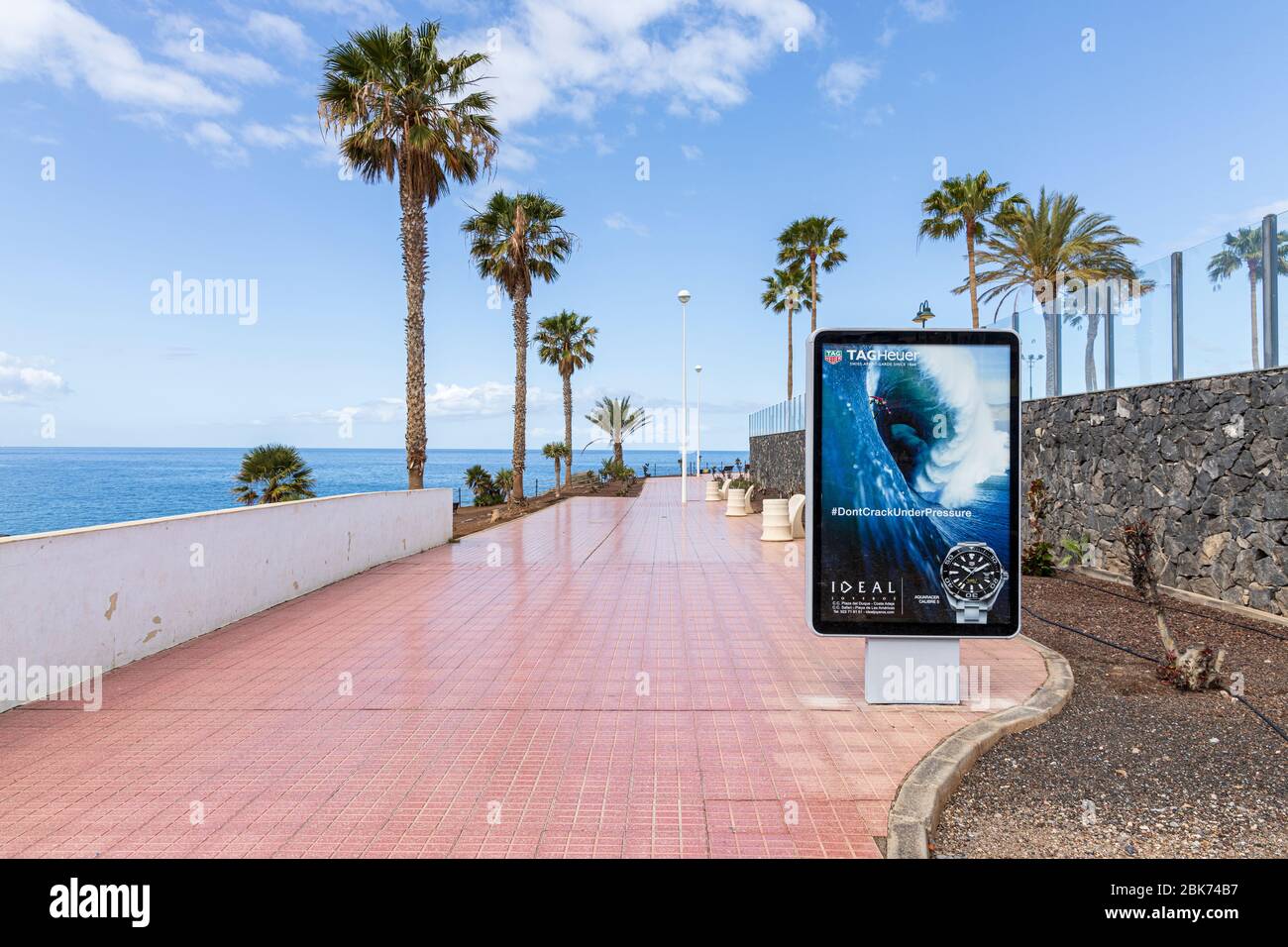 Advertising hoardings on a walkway during the covid 19 lockdown in the tourist resort area of Costa Adeje, Tenerife, Canary Islands, Spain Stock Photo