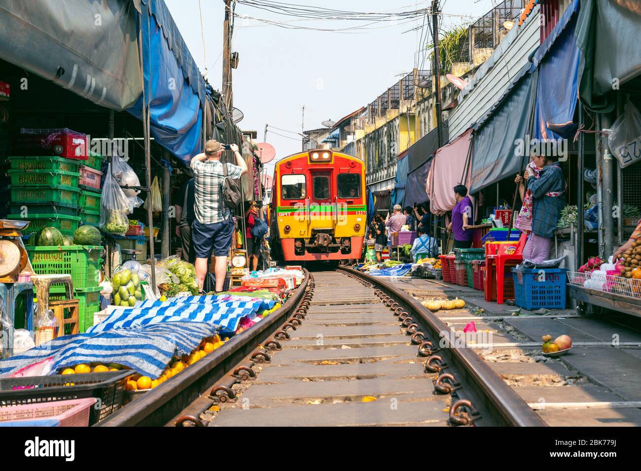 MAEKLONG, THAILAND - FEB 22, 2020 : Famous open air railway markets at Maeklong in Samutsongkram Province, Thailand. Stock Photo