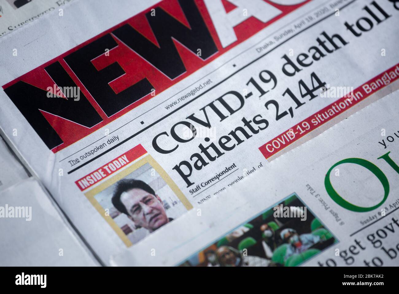 Today's headline of a popular English newspaper in Bangladesh is "COVID-19  death toll 84, Patients 2144 Stock Photo - Alamy