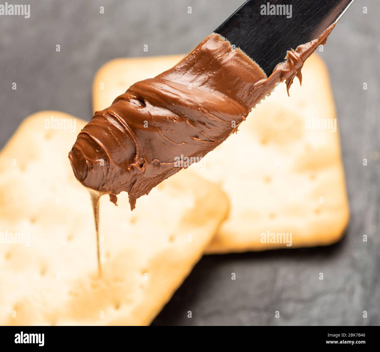 Hazelnut spread with a knife for spreading Stock Photo Alamy